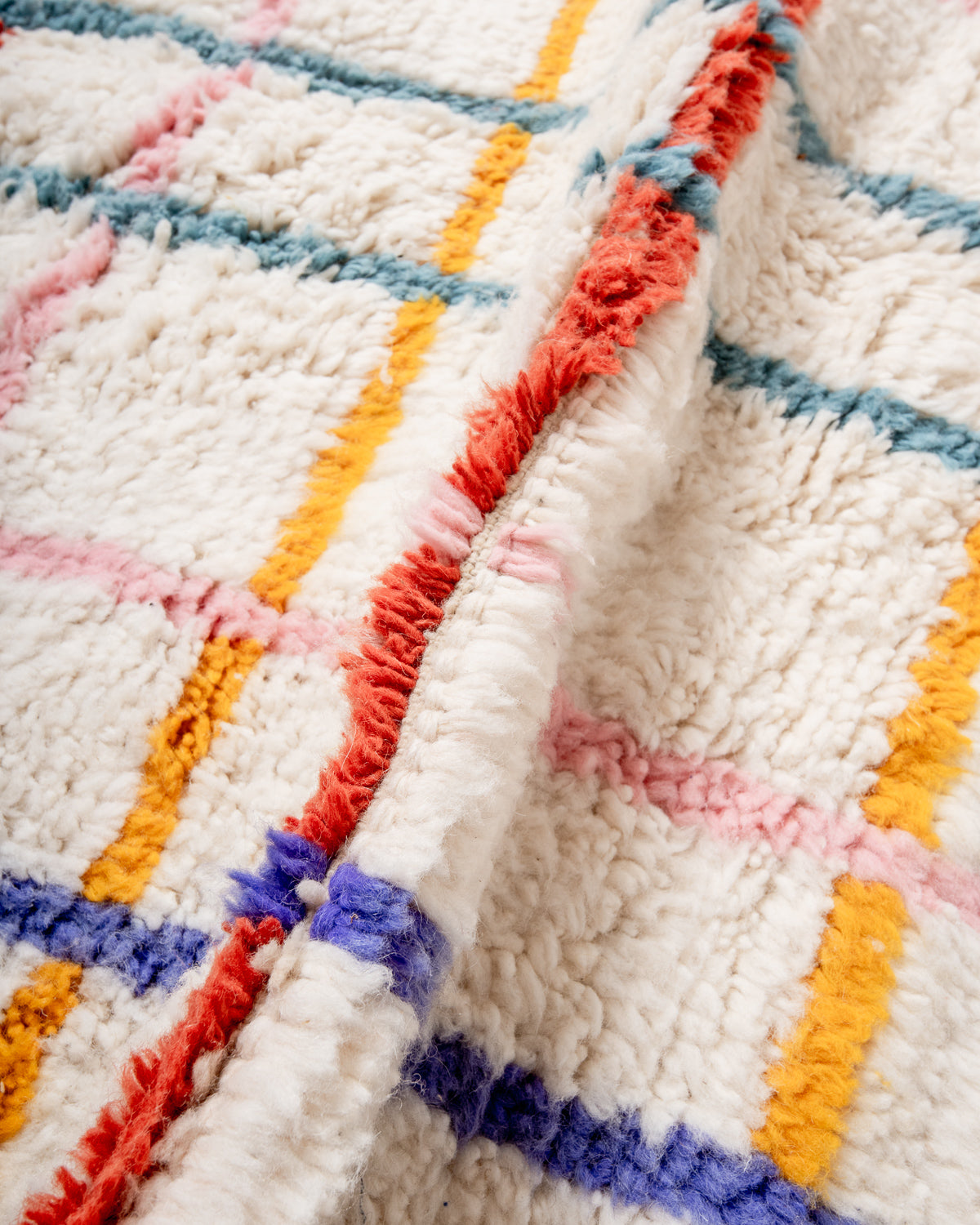 Modern, designer, handcrafted Berber rug from Morocco. Beniourain carpet with beautiful colours and patterns and fluffy wool texture.
